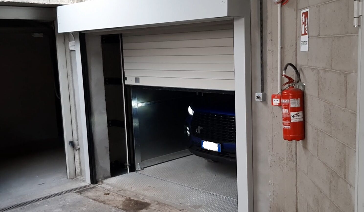 MONTAUTO_CARLIFT_SAGITTA_USCITA_PIANO_INFERIORE_EXIT_TO_UNDERGROUND_FLOOR_CMC_PARKLIFT-780x456